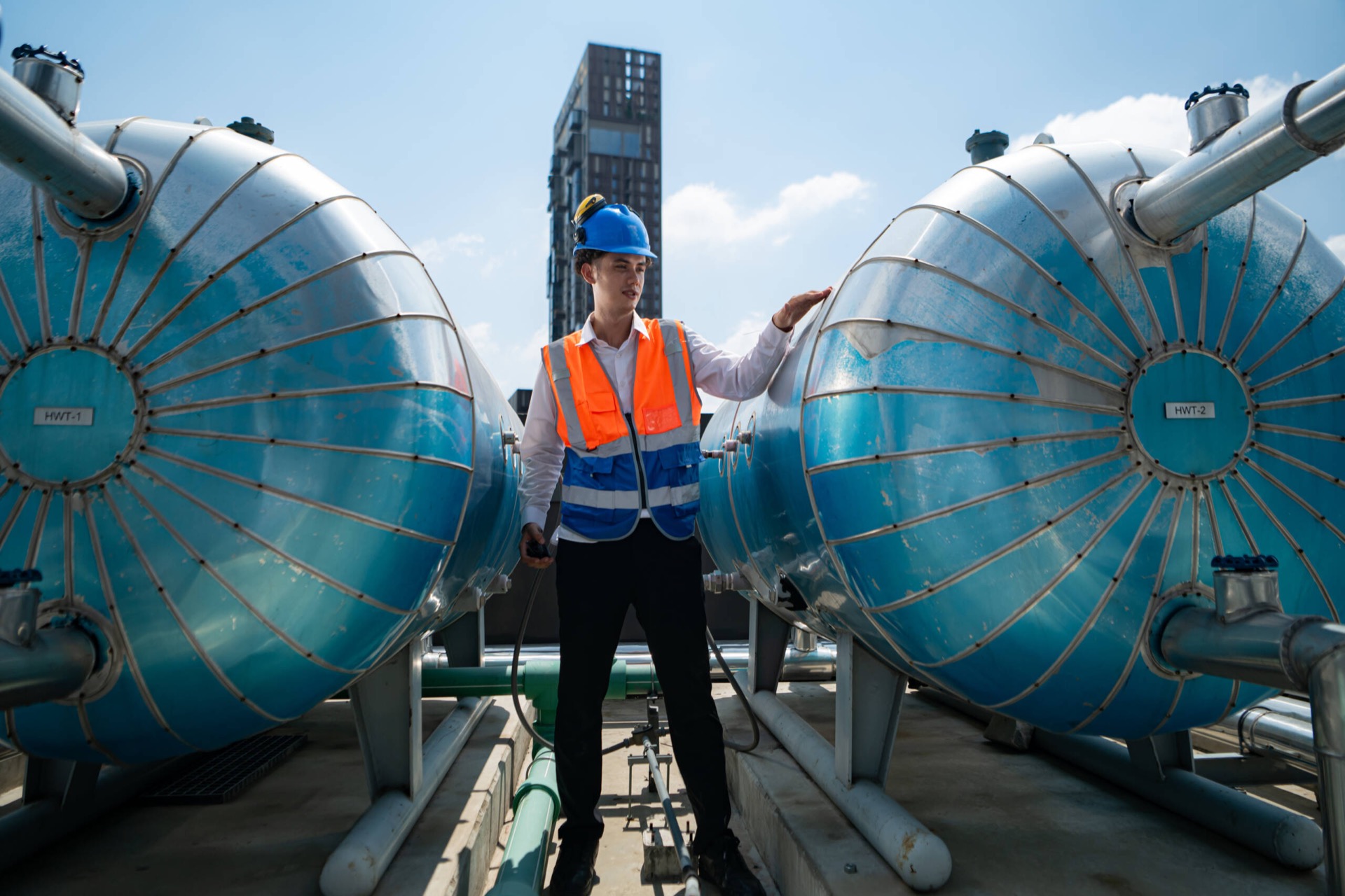 Engineer inspecting industrial water system vessels